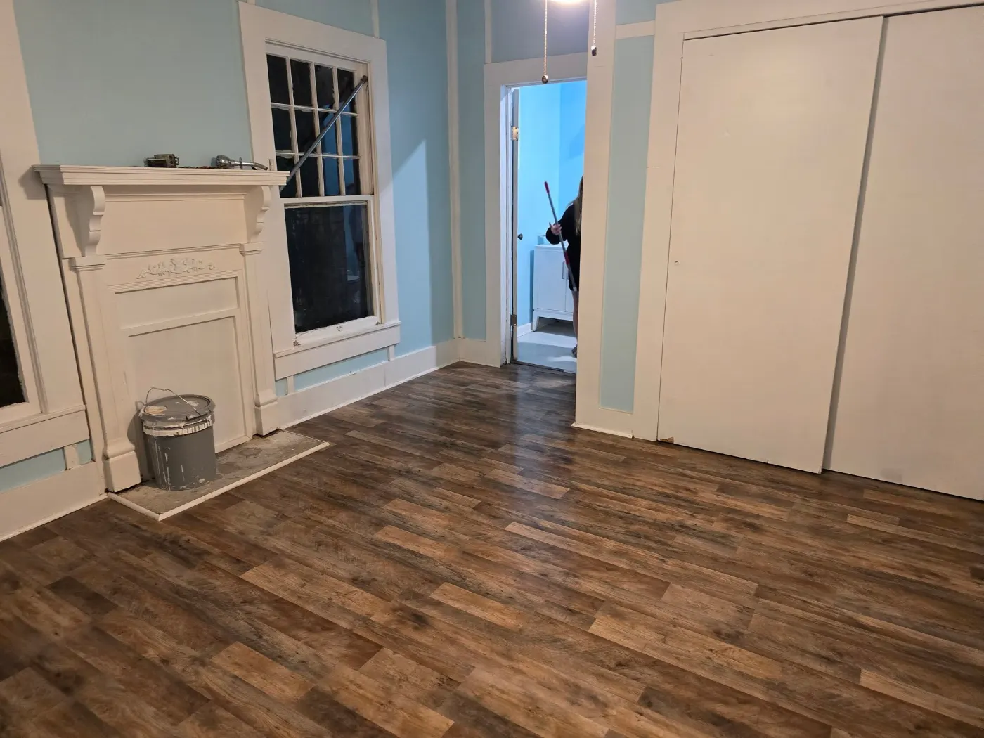 Living room with new wood-look floors by BuildRight Home Improvement