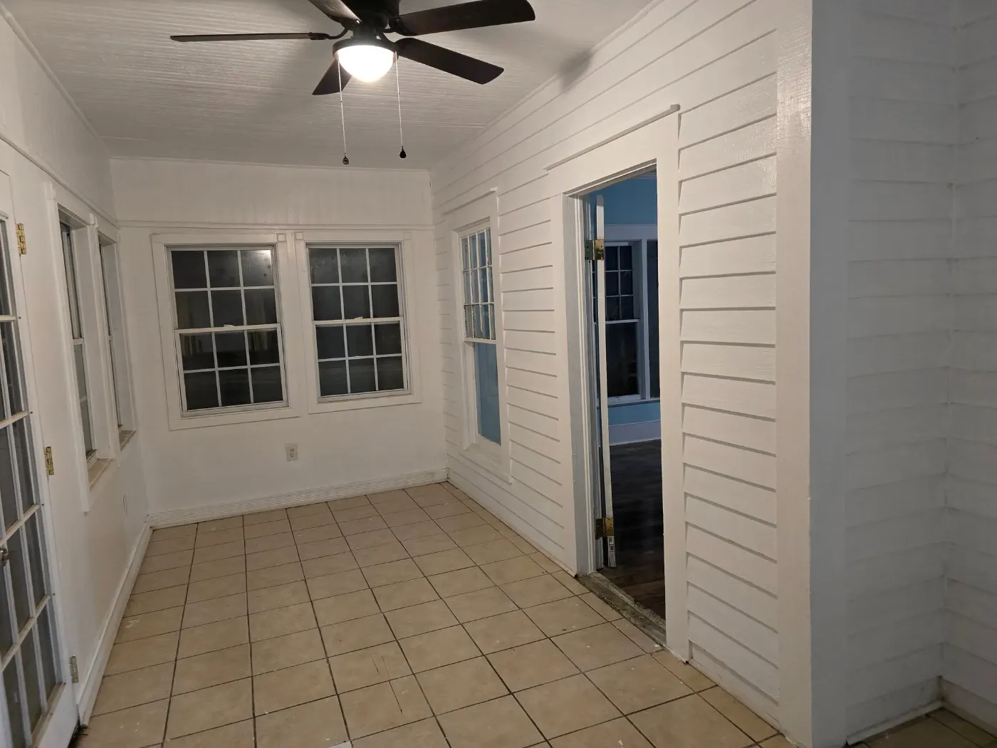 Shiplap room with a new tile floor by BuildRight Home Improvement