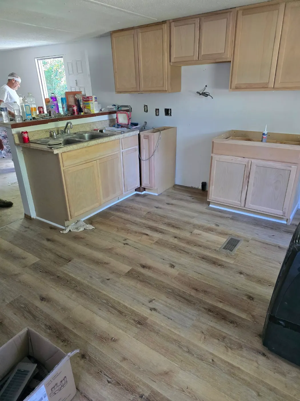 Kitchen refresh with new flooring by BuildRight Home Improvement
