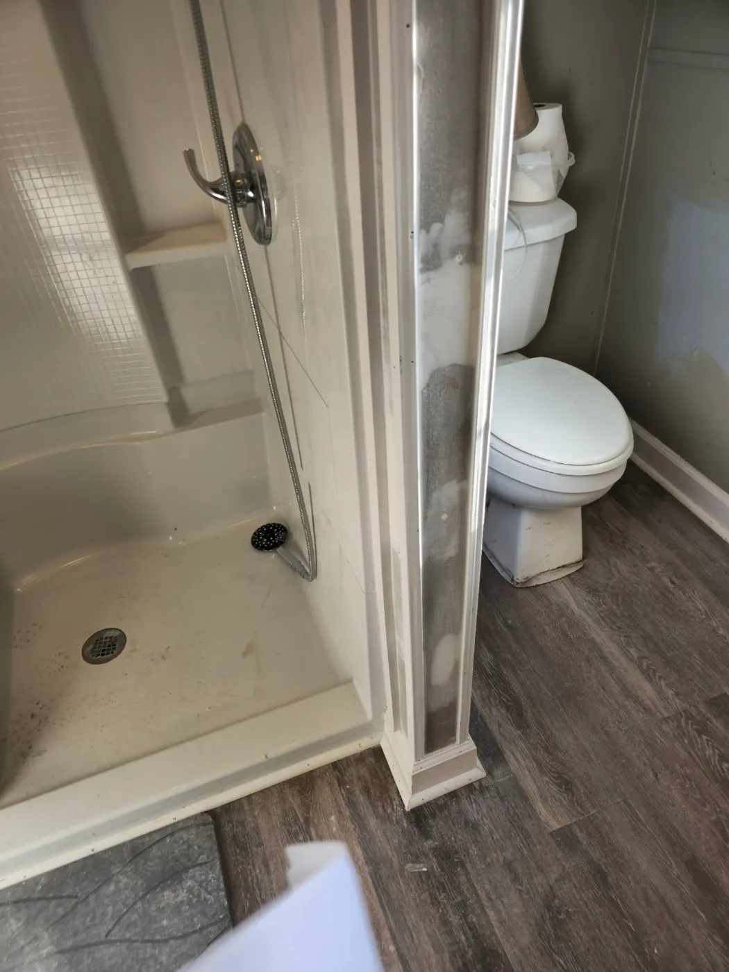 Bathroom with a new shower and floors by BuildRight Home Improvement