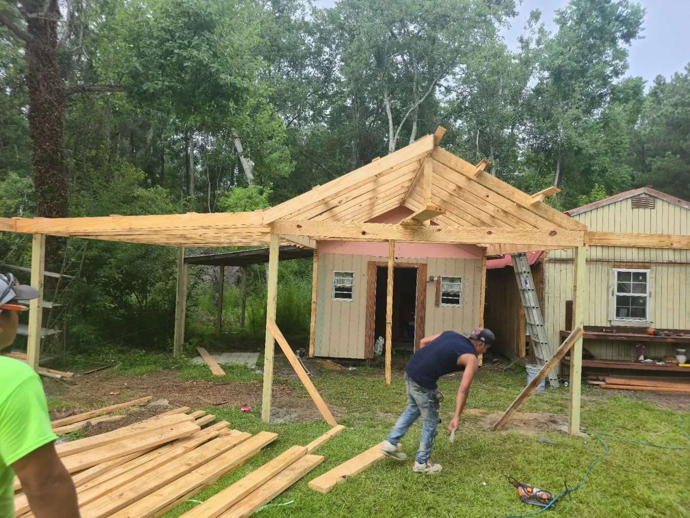 Crew framing a new covered porch by BuildRight Home Improvement