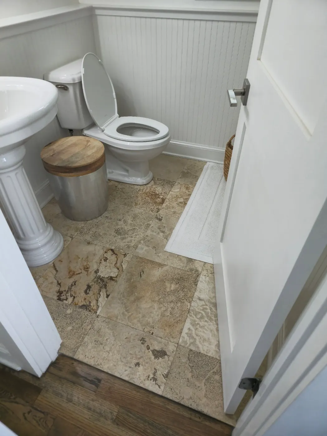 Bathroom with a new tile floor by BuildRight Home Improvement