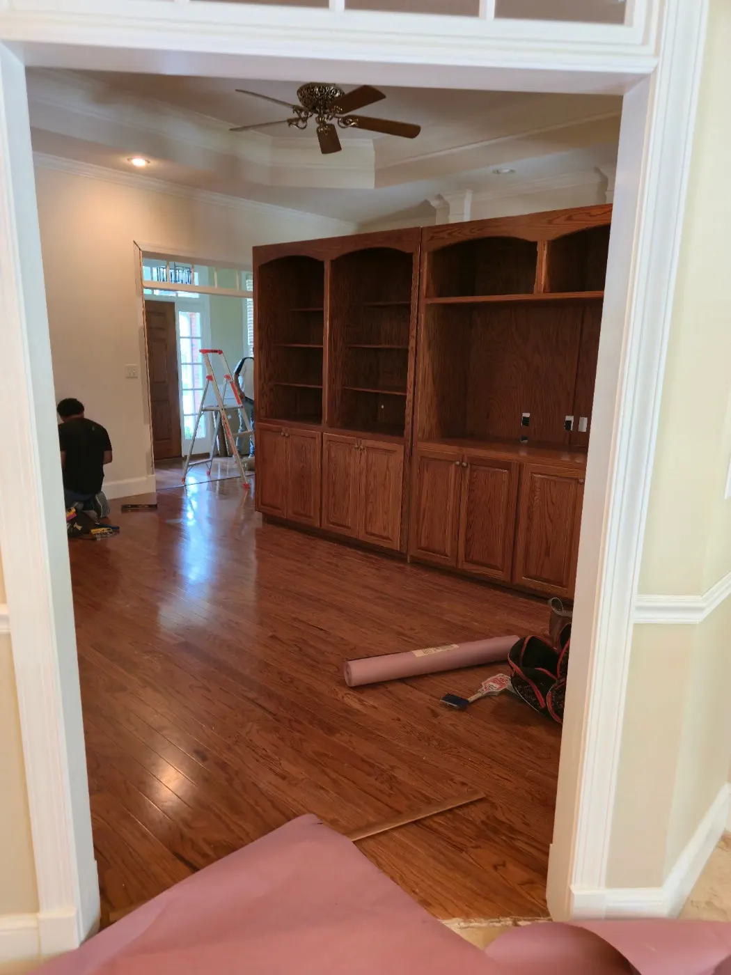 Built-in shelves and hardwood floors by BuildRight Home Improvement