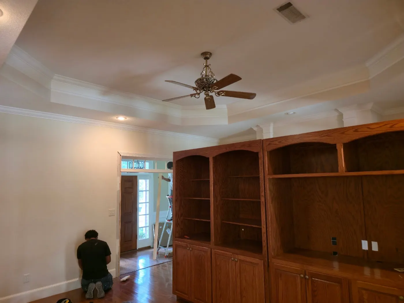 Living room with built-ins and new trim by BuildRight Home Improvement