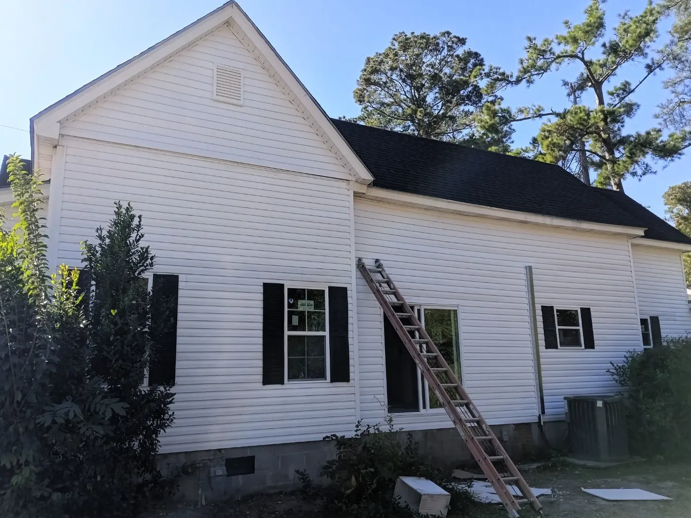 Siding job with the crew on site by BuildRight Home Improvement