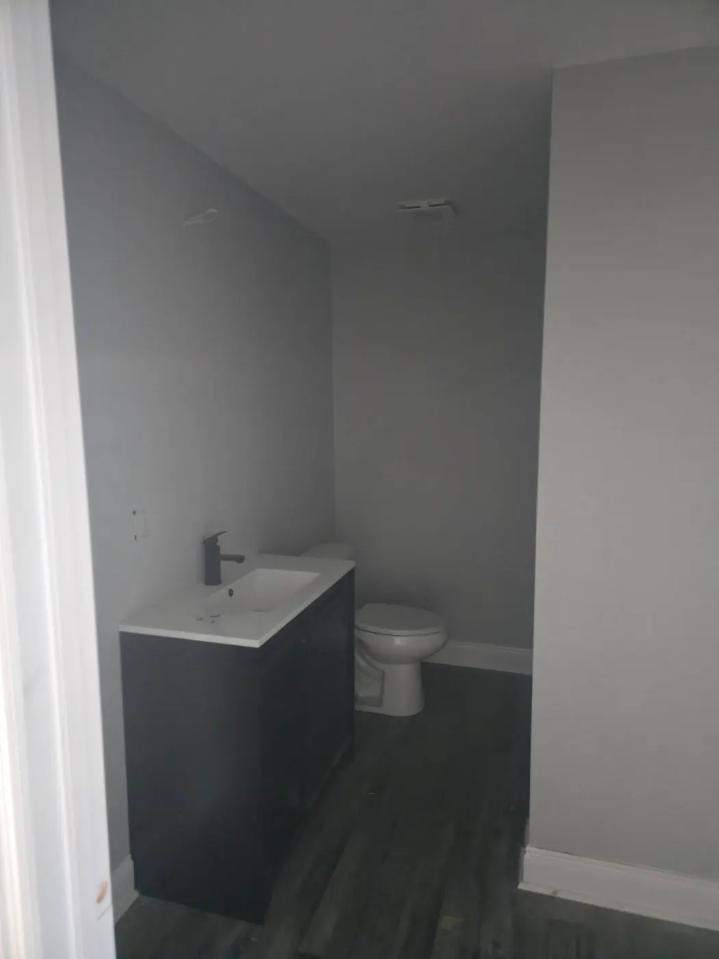 Half bath with a new vanity by BuildRight Home Improvement
