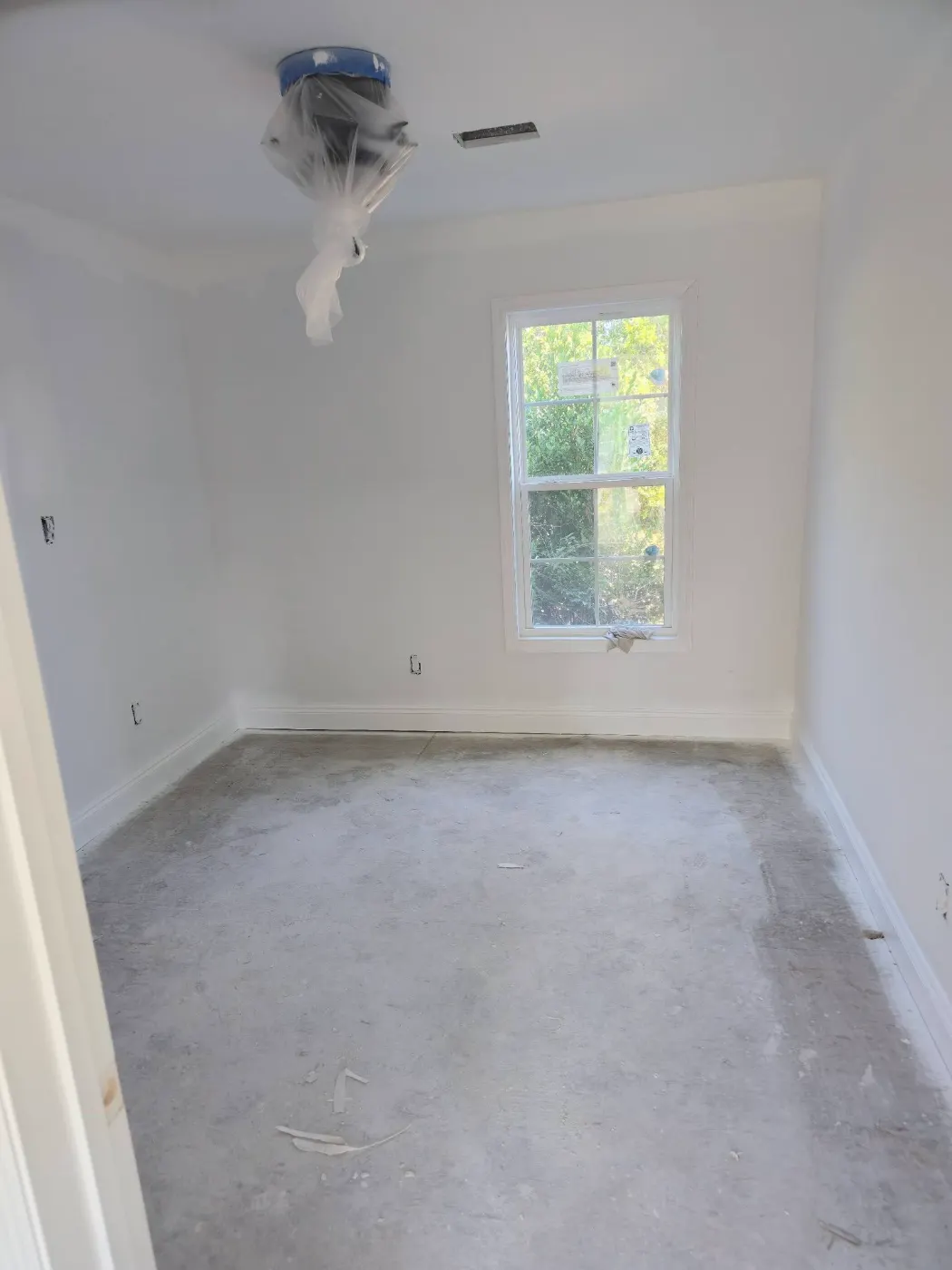 Bedroom with fresh paint and floors by BuildRight Home Improvement