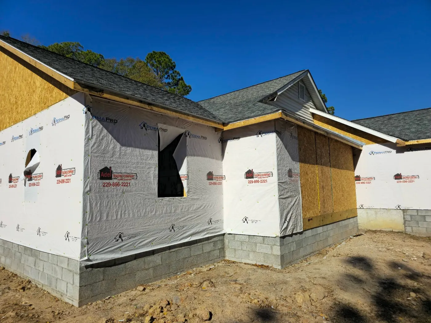 New build with house wrap on by BuildRight Home Improvement