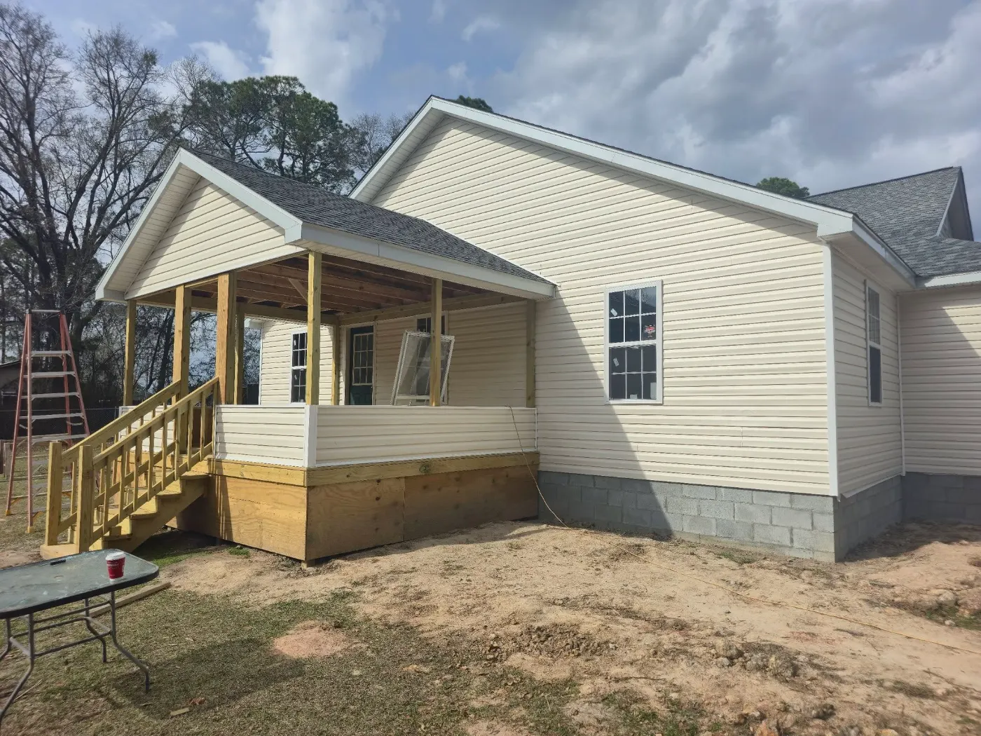 Finished new home with a front porch by BuildRight Home Improvement
