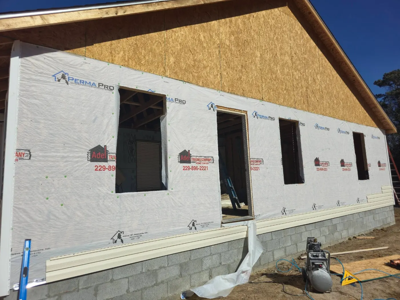House wrap and window openings by BuildRight Home Improvement