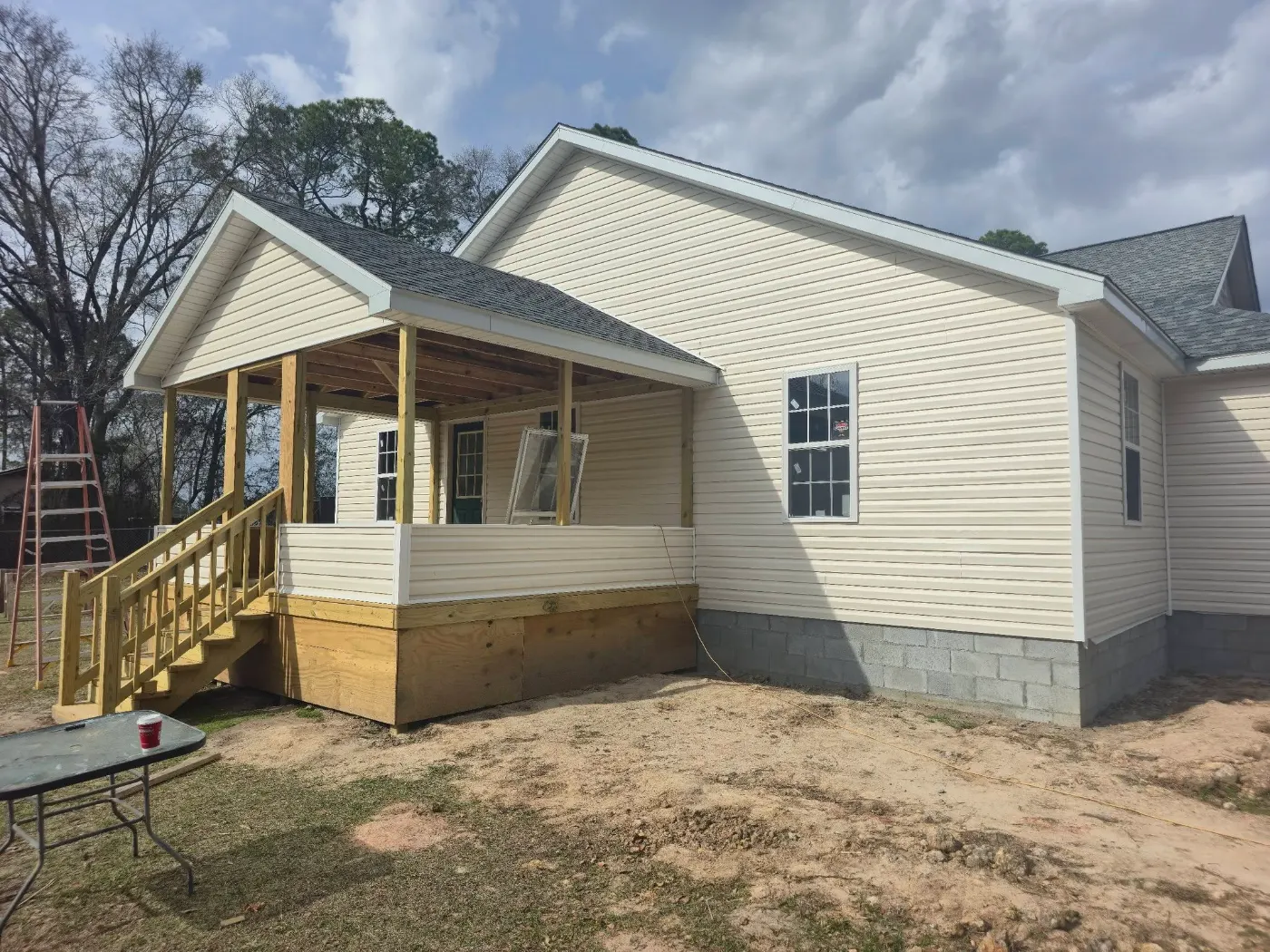 New home with a covered porch by BuildRight Home Improvement